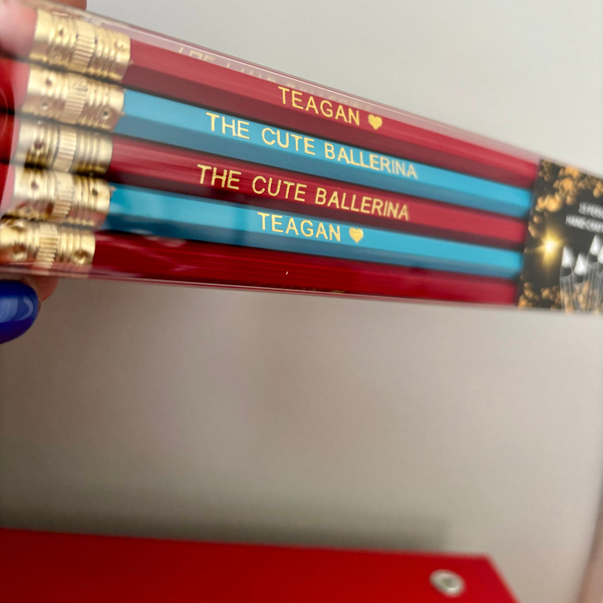 Set of personalized pencils with names 'Teagan' and 'The Cute Ballerina' on a plain background.